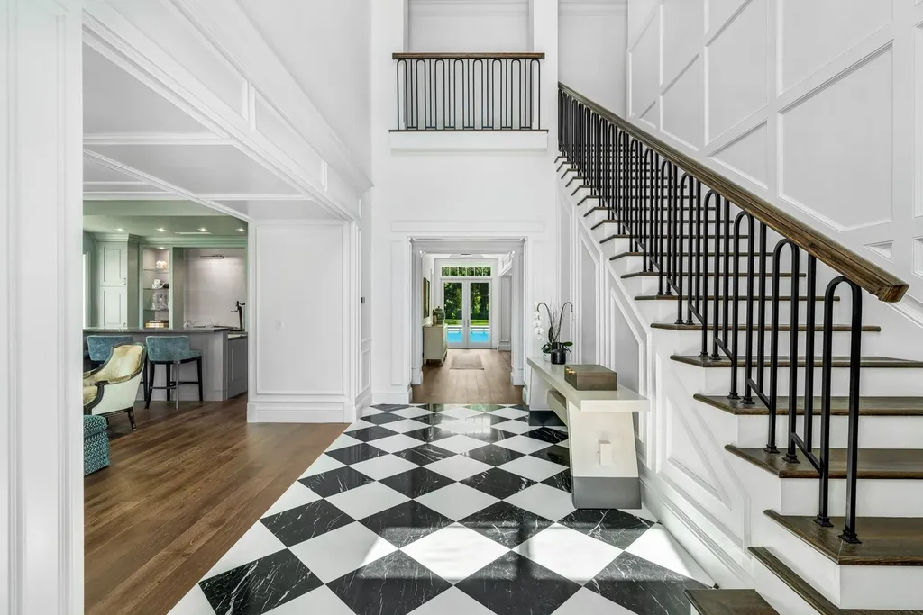 8840 SW 61st Court Home in Pinecrest, Florida. Explore this exquisite European-inspired home in N. Pinecrest, boasting 7 bedrooms and 7.5 bathrooms. From the formal living room with a wine cellar to the showstopper kitchen, this residence exudes elegance and sophistication.