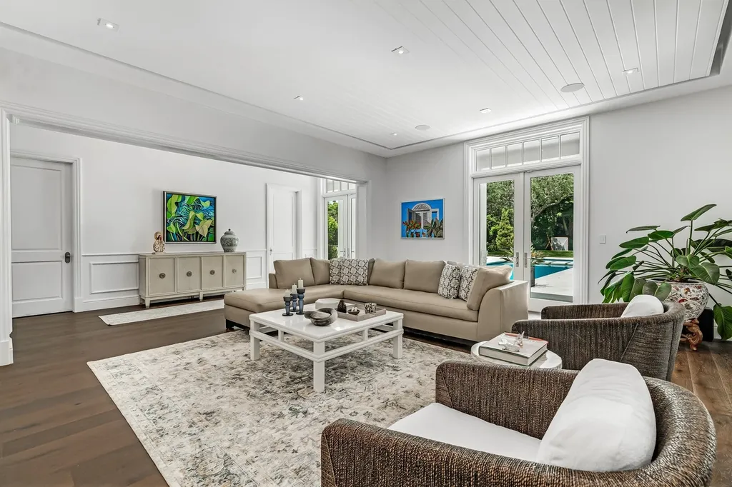 8840 SW 61st Court Home in Pinecrest, Florida. Explore this exquisite European-inspired home in N. Pinecrest, boasting 7 bedrooms and 7.5 bathrooms. From the formal living room with a wine cellar to the showstopper kitchen, this residence exudes elegance and sophistication.