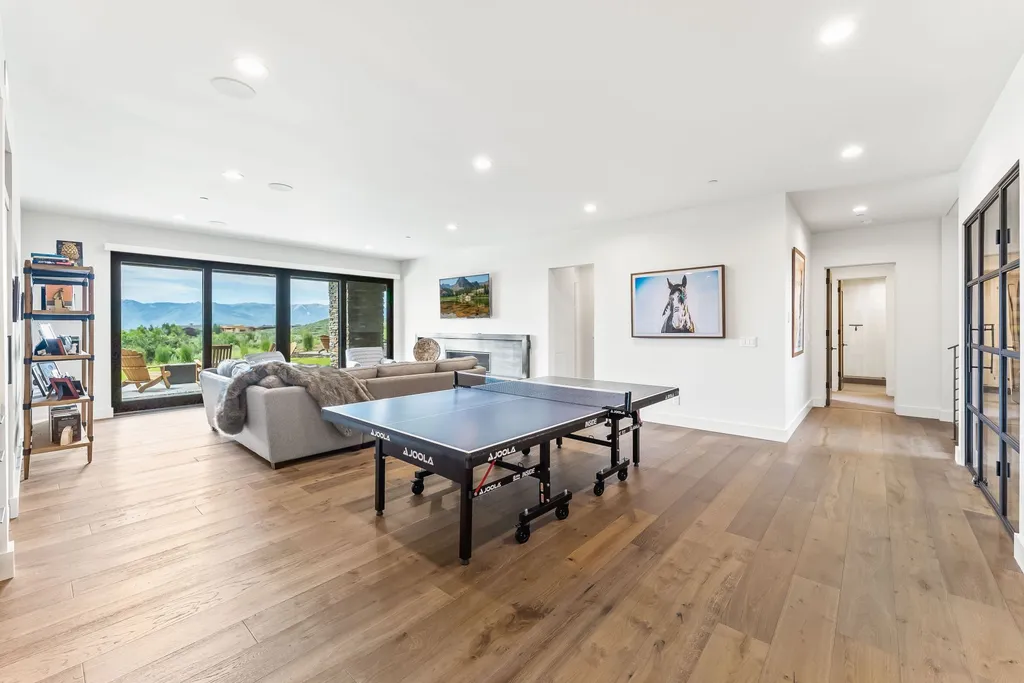 9310 Golden Spike Court Home in Park City, Utah. Discover this extraordinary custom home nestled on a 1.59-acre lot in Promontory's sought-after Summit neighborhood. Boasting stunning stone and cedar architecture under a striking copper roof, this home offers unobstructed ski area views and direct access to acres of open space. 