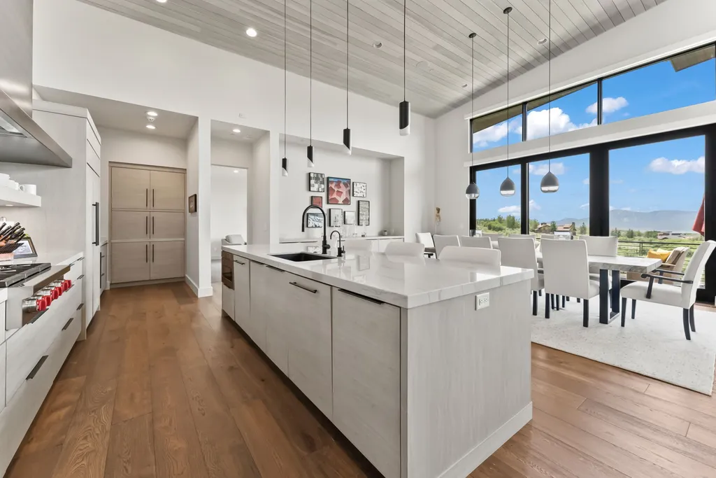 9310 Golden Spike Court Home in Park City, Utah. Discover this extraordinary custom home nestled on a 1.59-acre lot in Promontory's sought-after Summit neighborhood. Boasting stunning stone and cedar architecture under a striking copper roof, this home offers unobstructed ski area views and direct access to acres of open space. 