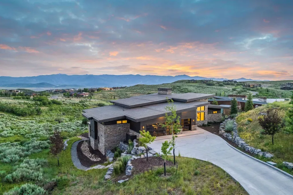 9310 Golden Spike Court Home in Park City, Utah. Discover this extraordinary custom home nestled on a 1.59-acre lot in Promontory's sought-after Summit neighborhood. Boasting stunning stone and cedar architecture under a striking copper roof, this home offers unobstructed ski area views and direct access to acres of open space. 