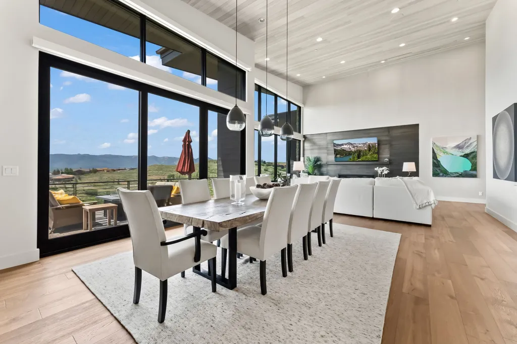 9310 Golden Spike Court Home in Park City, Utah. Discover this extraordinary custom home nestled on a 1.59-acre lot in Promontory's sought-after Summit neighborhood. Boasting stunning stone and cedar architecture under a striking copper roof, this home offers unobstructed ski area views and direct access to acres of open space. 