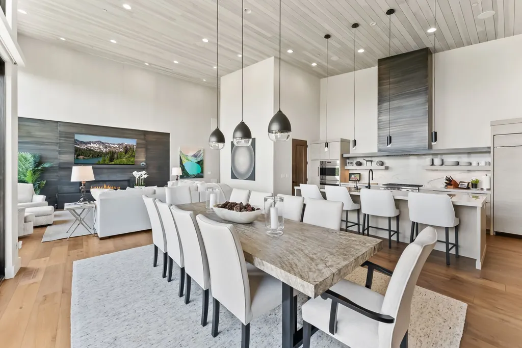 9310 Golden Spike Court Home in Park City, Utah. Discover this extraordinary custom home nestled on a 1.59-acre lot in Promontory's sought-after Summit neighborhood. Boasting stunning stone and cedar architecture under a striking copper roof, this home offers unobstructed ski area views and direct access to acres of open space. 