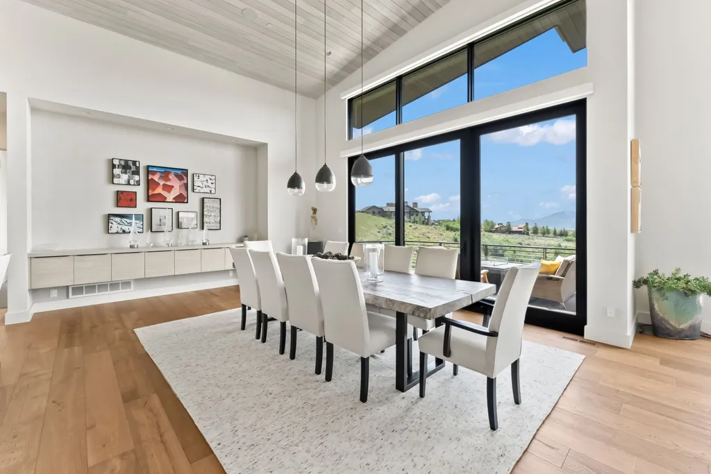 9310 Golden Spike Court Home in Park City, Utah. Discover this extraordinary custom home nestled on a 1.59-acre lot in Promontory's sought-after Summit neighborhood. Boasting stunning stone and cedar architecture under a striking copper roof, this home offers unobstructed ski area views and direct access to acres of open space. 