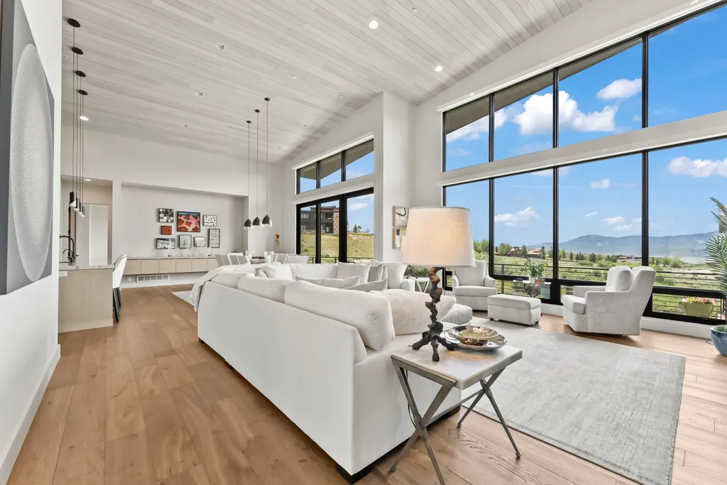 9310 Golden Spike Court Home in Park City, Utah. Discover this extraordinary custom home nestled on a 1.59-acre lot in Promontory's sought-after Summit neighborhood. Boasting stunning stone and cedar architecture under a striking copper roof, this home offers unobstructed ski area views and direct access to acres of open space. 