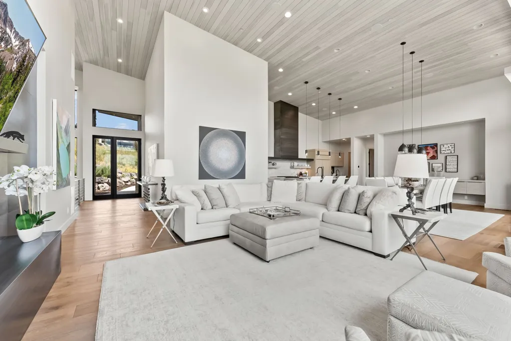 9310 Golden Spike Court Home in Park City, Utah. Discover this extraordinary custom home nestled on a 1.59-acre lot in Promontory's sought-after Summit neighborhood. Boasting stunning stone and cedar architecture under a striking copper roof, this home offers unobstructed ski area views and direct access to acres of open space. 