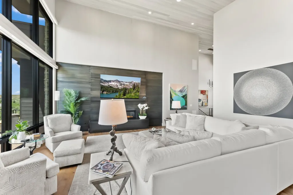 9310 Golden Spike Court Home in Park City, Utah. Discover this extraordinary custom home nestled on a 1.59-acre lot in Promontory's sought-after Summit neighborhood. Boasting stunning stone and cedar architecture under a striking copper roof, this home offers unobstructed ski area views and direct access to acres of open space. 
