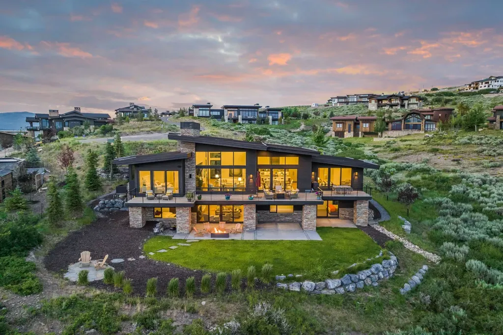 9310 Golden Spike Court Home in Park City, Utah. Discover this extraordinary custom home nestled on a 1.59-acre lot in Promontory's sought-after Summit neighborhood. Boasting stunning stone and cedar architecture under a striking copper roof, this home offers unobstructed ski area views and direct access to acres of open space. 