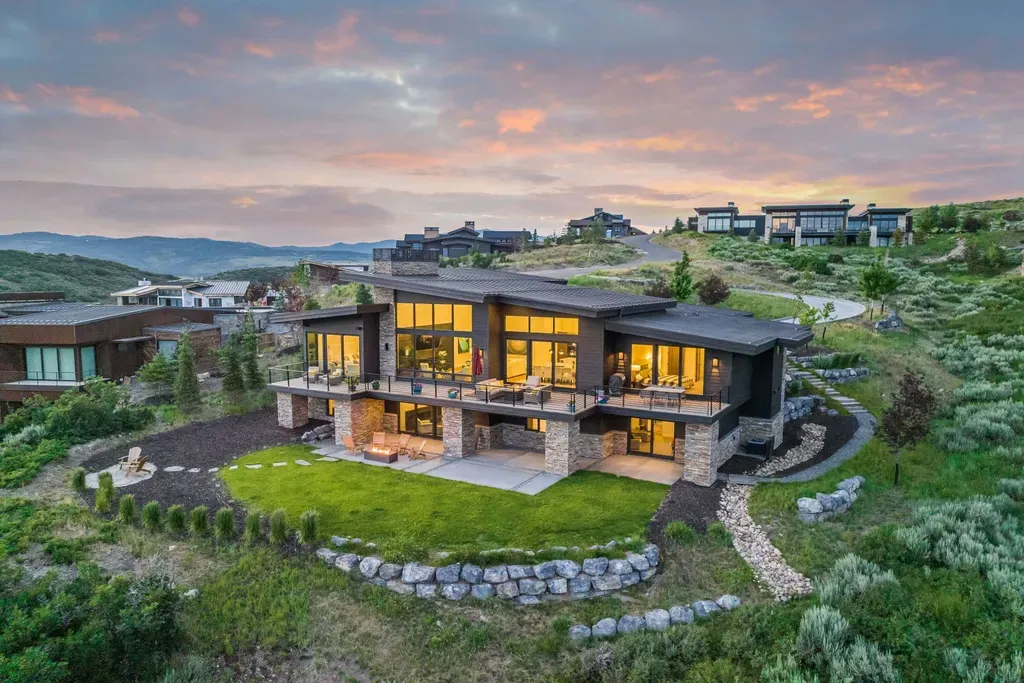 9310 Golden Spike Court Home in Park City, Utah. Discover this extraordinary custom home nestled on a 1.59-acre lot in Promontory's sought-after Summit neighborhood. Boasting stunning stone and cedar architecture under a striking copper roof, this home offers unobstructed ski area views and direct access to acres of open space. 