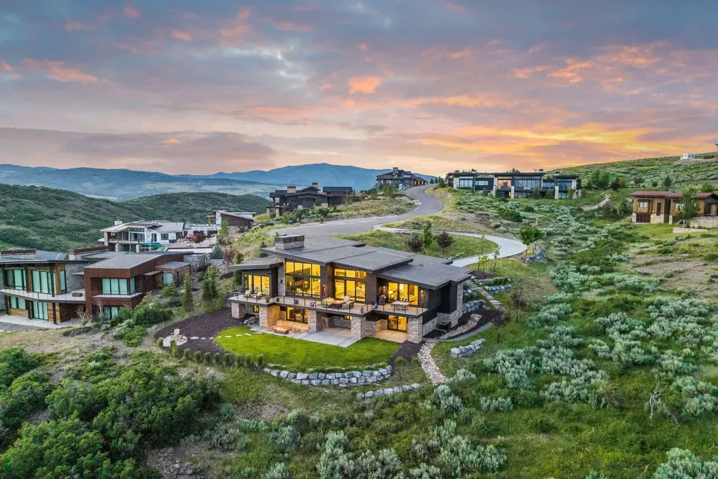 9310 Golden Spike Court Home in Park City, Utah. Discover this extraordinary custom home nestled on a 1.59-acre lot in Promontory's sought-after Summit neighborhood. Boasting stunning stone and cedar architecture under a striking copper roof, this home offers unobstructed ski area views and direct access to acres of open space. 