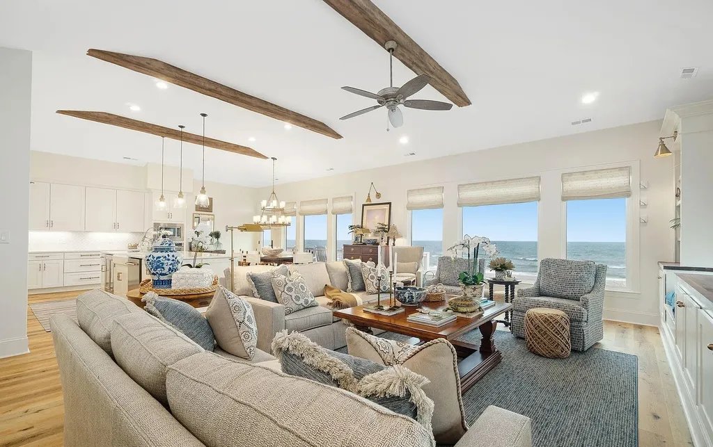 9721 Dolphin Ridge Road Home in Emerald Isle, North Carolina. Discover the epitome of oceanfront living in this exquisite Dolphin Ridge home, where luxury and customization intertwine to create a one-of-a-kind island sanctuary. Immerse yourself in the coastal lifestyle as you step into this beautifully furnished abode, thoughtfully tailored by the builder/owners to offer a seamless blend of comfort and sophistication.