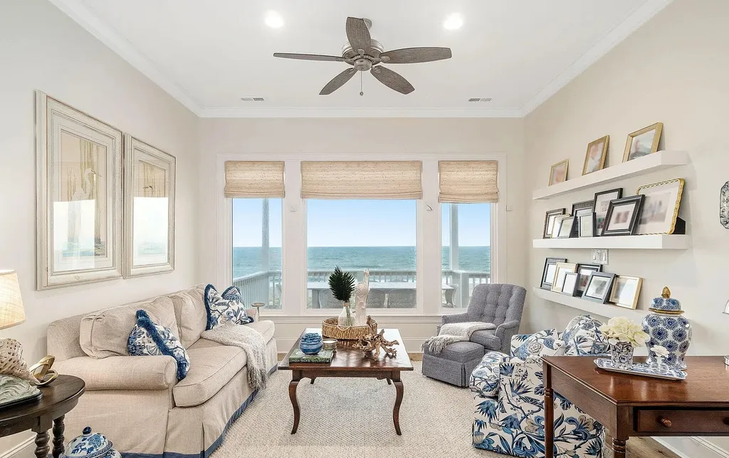9721 Dolphin Ridge Road Home in Emerald Isle, North Carolina. Discover the epitome of oceanfront living in this exquisite Dolphin Ridge home, where luxury and customization intertwine to create a one-of-a-kind island sanctuary. Immerse yourself in the coastal lifestyle as you step into this beautifully furnished abode, thoughtfully tailored by the builder/owners to offer a seamless blend of comfort and sophistication.