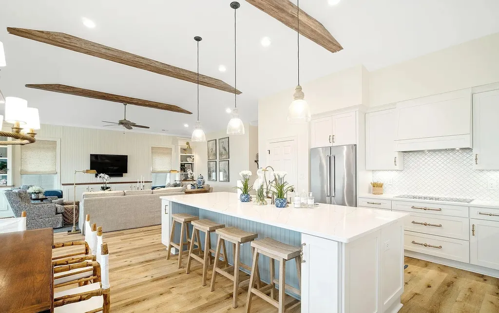 9721 Dolphin Ridge Road Home in Emerald Isle, North Carolina. Discover the epitome of oceanfront living in this exquisite Dolphin Ridge home, where luxury and customization intertwine to create a one-of-a-kind island sanctuary. Immerse yourself in the coastal lifestyle as you step into this beautifully furnished abode, thoughtfully tailored by the builder/owners to offer a seamless blend of comfort and sophistication.
