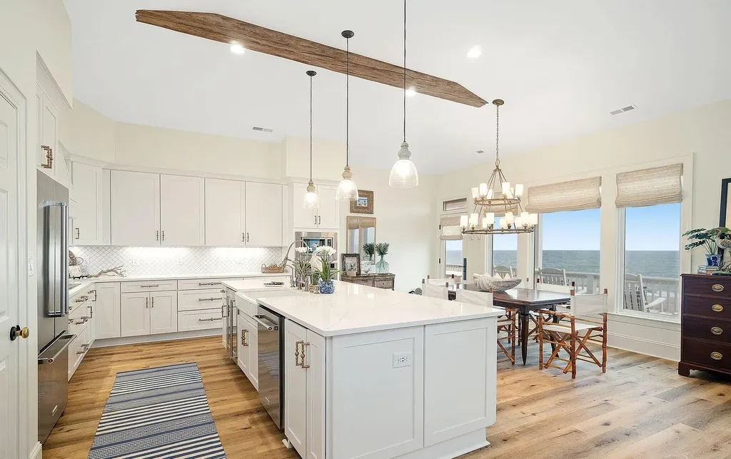 9721 Dolphin Ridge Road Home in Emerald Isle, North Carolina. Discover the epitome of oceanfront living in this exquisite Dolphin Ridge home, where luxury and customization intertwine to create a one-of-a-kind island sanctuary. Immerse yourself in the coastal lifestyle as you step into this beautifully furnished abode, thoughtfully tailored by the builder/owners to offer a seamless blend of comfort and sophistication.