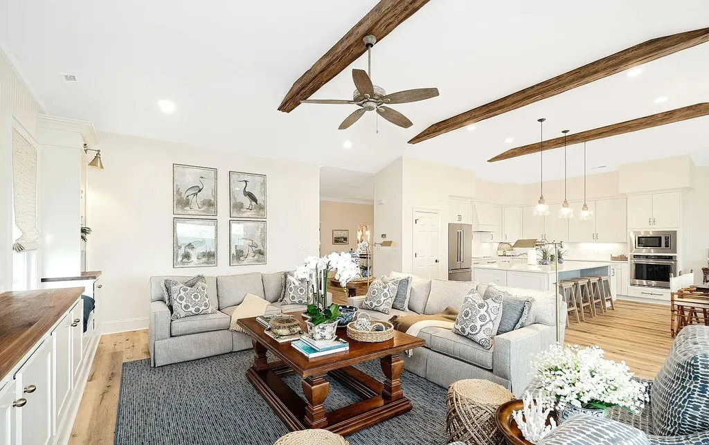 9721 Dolphin Ridge Road Home in Emerald Isle, North Carolina. Discover the epitome of oceanfront living in this exquisite Dolphin Ridge home, where luxury and customization intertwine to create a one-of-a-kind island sanctuary. Immerse yourself in the coastal lifestyle as you step into this beautifully furnished abode, thoughtfully tailored by the builder/owners to offer a seamless blend of comfort and sophistication.
