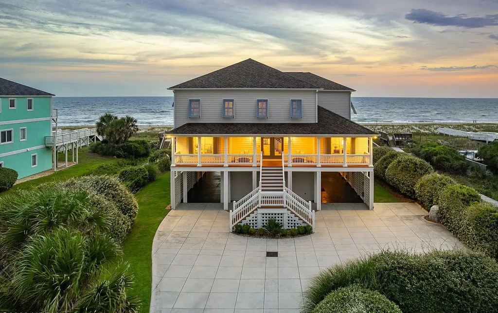 9721 Dolphin Ridge Road Home in Emerald Isle, North Carolina. Discover the epitome of oceanfront living in this exquisite Dolphin Ridge home, where luxury and customization intertwine to create a one-of-a-kind island sanctuary. Immerse yourself in the coastal lifestyle as you step into this beautifully furnished abode, thoughtfully tailored by the builder/owners to offer a seamless blend of comfort and sophistication.
