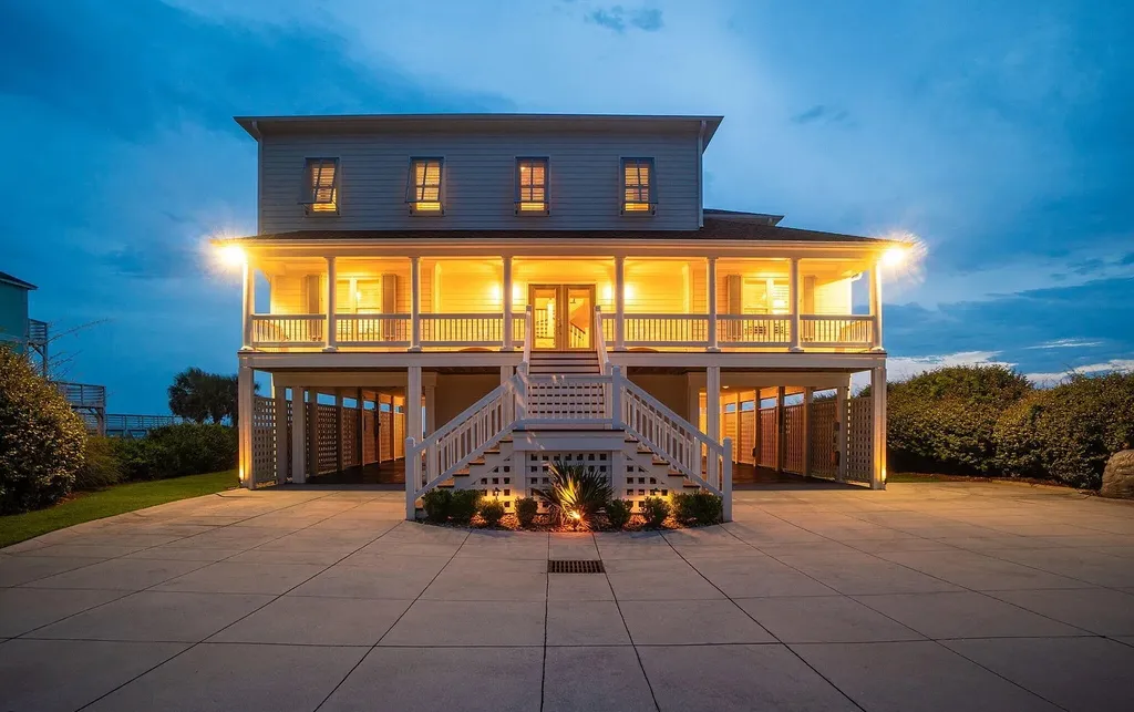 9721 Dolphin Ridge Road Home in Emerald Isle, North Carolina. Discover the epitome of oceanfront living in this exquisite Dolphin Ridge home, where luxury and customization intertwine to create a one-of-a-kind island sanctuary. Immerse yourself in the coastal lifestyle as you step into this beautifully furnished abode, thoughtfully tailored by the builder/owners to offer a seamless blend of comfort and sophistication.