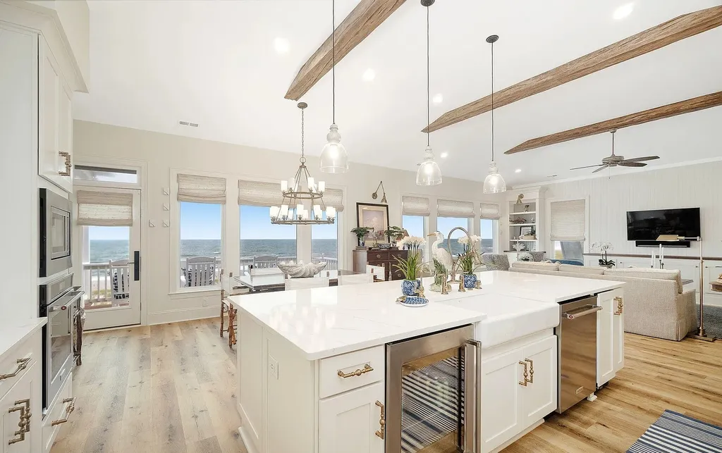9721 Dolphin Ridge Road Home in Emerald Isle, North Carolina. Discover the epitome of oceanfront living in this exquisite Dolphin Ridge home, where luxury and customization intertwine to create a one-of-a-kind island sanctuary. Immerse yourself in the coastal lifestyle as you step into this beautifully furnished abode, thoughtfully tailored by the builder/owners to offer a seamless blend of comfort and sophistication.