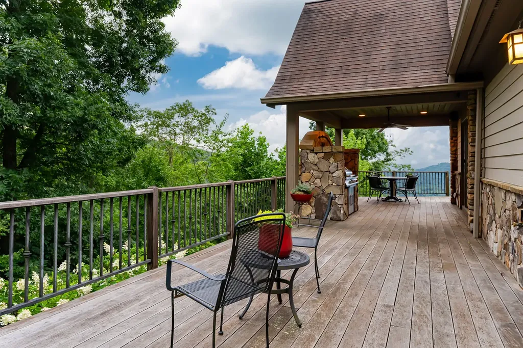 99 Crestridge Drive Home in Asheville, North Carolina. Discover a private haven in the exclusive Poplar Ridge community. Set at 3,000 ft elevation on 3+ acres, this home offers unmatched tranquility and stunning panoramic views. With main level living, gourmet kitchen, outdoor decks, and entertainment options like a media room and hot tub, this residence defines relaxation and comfort.