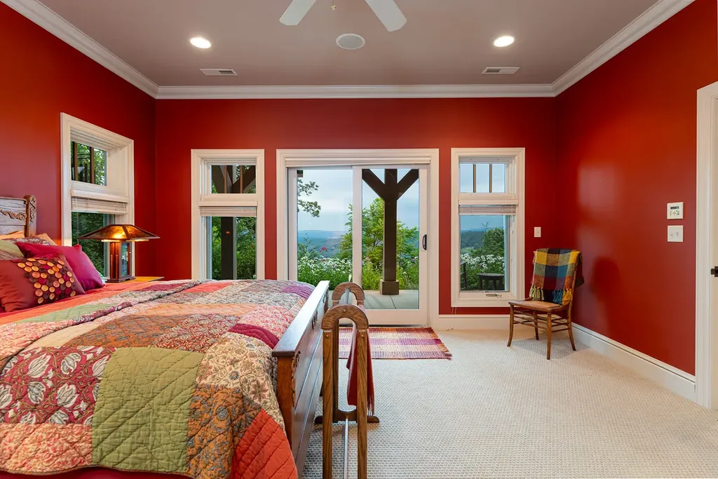 99 Crestridge Drive Home in Asheville, North Carolina. Discover a private haven in the exclusive Poplar Ridge community. Set at 3,000 ft elevation on 3+ acres, this home offers unmatched tranquility and stunning panoramic views. With main level living, gourmet kitchen, outdoor decks, and entertainment options like a media room and hot tub, this residence defines relaxation and comfort.