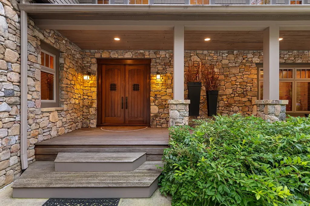 99 Crestridge Drive Home in Asheville, North Carolina. Discover a private haven in the exclusive Poplar Ridge community. Set at 3,000 ft elevation on 3+ acres, this home offers unmatched tranquility and stunning panoramic views. With main level living, gourmet kitchen, outdoor decks, and entertainment options like a media room and hot tub, this residence defines relaxation and comfort.