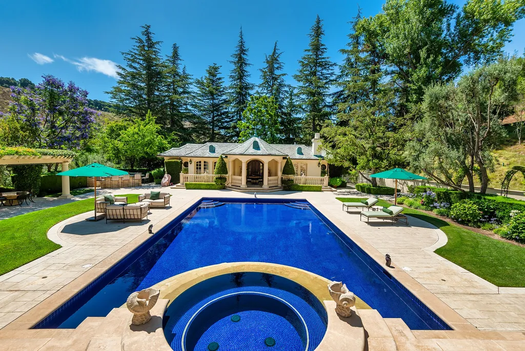 997 Brook Meadow Court Home in Westlake Village, California. Experience the epitome of luxury in this French country masterpiece located in the prestigious North Ranch Country Club Estates. Designed by renowned architect Ron Firestone, this iconic estate features a grand entry, theater, elevator, formal dining, bonus room, wine cellar, and a stunning primary suite. 