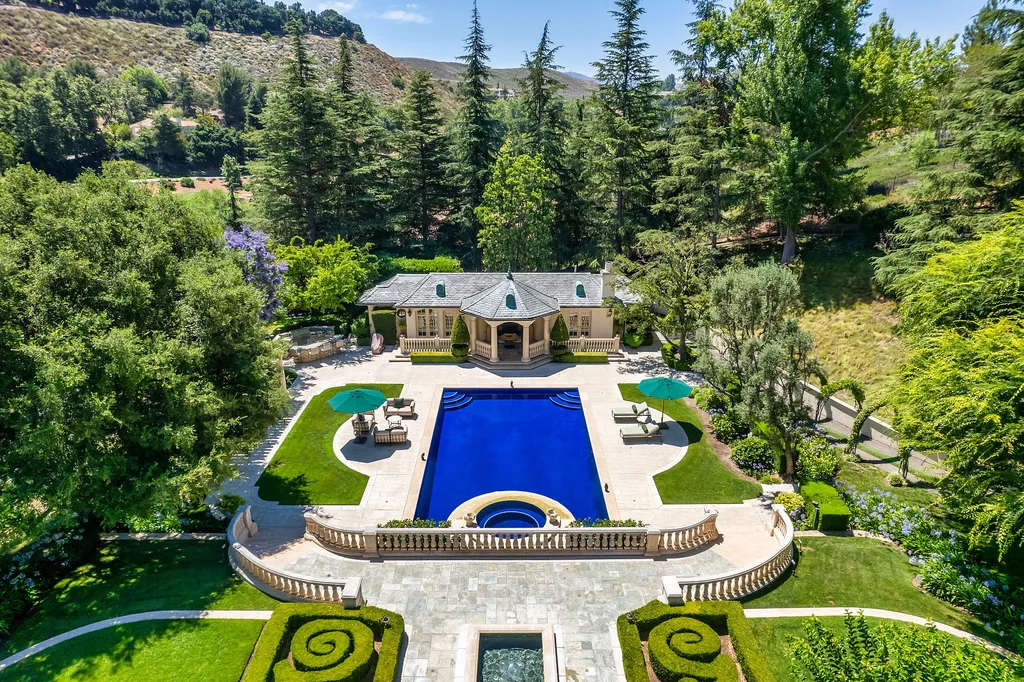 997 Brook Meadow Court Home in Westlake Village, California. Experience the epitome of luxury in this French country masterpiece located in the prestigious North Ranch Country Club Estates. Designed by renowned architect Ron Firestone, this iconic estate features a grand entry, theater, elevator, formal dining, bonus room, wine cellar, and a stunning primary suite. 