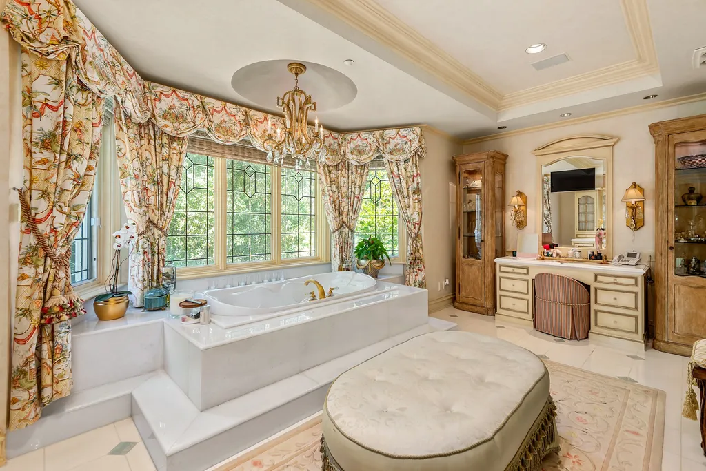 997 Brook Meadow Court Home in Westlake Village, California. Experience the epitome of luxury in this French country masterpiece located in the prestigious North Ranch Country Club Estates. Designed by renowned architect Ron Firestone, this iconic estate features a grand entry, theater, elevator, formal dining, bonus room, wine cellar, and a stunning primary suite. 