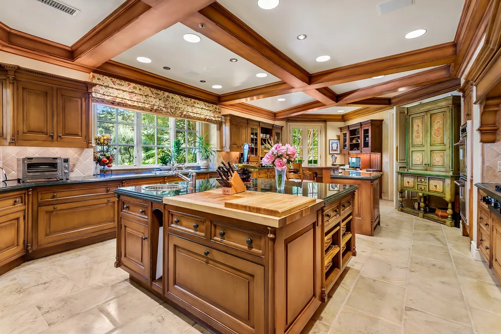 997 Brook Meadow Court Home in Westlake Village, California. Experience the epitome of luxury in this French country masterpiece located in the prestigious North Ranch Country Club Estates. Designed by renowned architect Ron Firestone, this iconic estate features a grand entry, theater, elevator, formal dining, bonus room, wine cellar, and a stunning primary suite. 