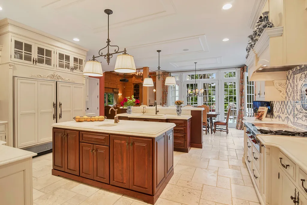 1 Lockhern Drive Home in Livingston Township, New Jersey. Step into the world of opulence with this custom-built, all-brick French Manor nestled on a tranquil cul-de-sac. The mature landscaping, saltwater pool, hot tub, limestone pool deck, and outdoor fireplace spanning 30 feet create a private oasis. Inside, discover a grand entrance hall leading to a stunning living room with a soaring 2-story ceiling, fireplace, and French doors opening to the patio and pool.
