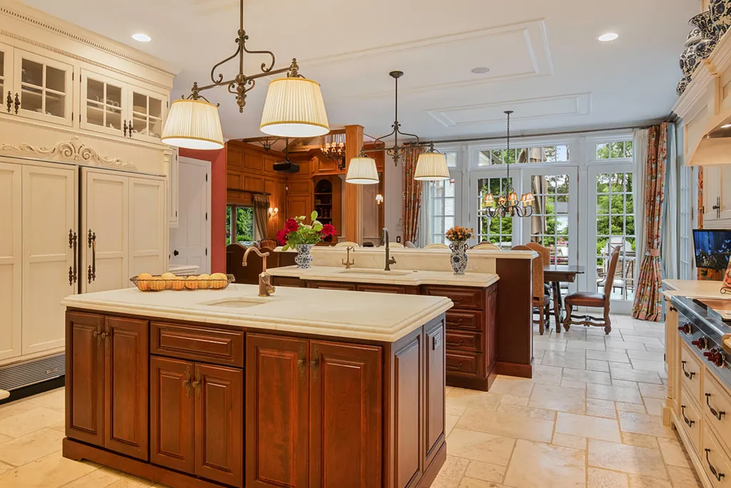1 Lockhern Drive Home in Livingston Township, New Jersey. Step into the world of opulence with this custom-built, all-brick French Manor nestled on a tranquil cul-de-sac. The mature landscaping, saltwater pool, hot tub, limestone pool deck, and outdoor fireplace spanning 30 feet create a private oasis. Inside, discover a grand entrance hall leading to a stunning living room with a soaring 2-story ceiling, fireplace, and French doors opening to the patio and pool.