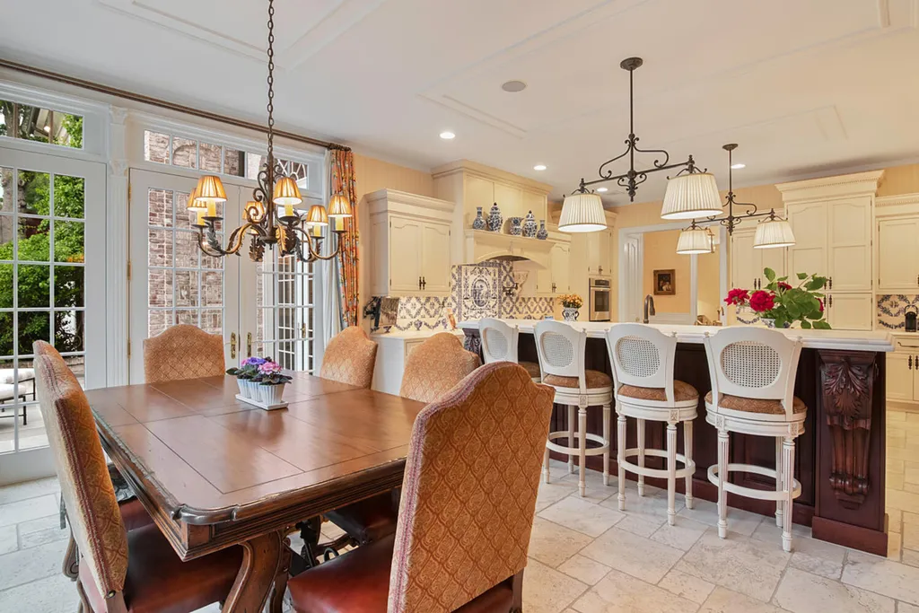 1 Lockhern Drive Home in Livingston Township, New Jersey. Step into the world of opulence with this custom-built, all-brick French Manor nestled on a tranquil cul-de-sac. The mature landscaping, saltwater pool, hot tub, limestone pool deck, and outdoor fireplace spanning 30 feet create a private oasis. Inside, discover a grand entrance hall leading to a stunning living room with a soaring 2-story ceiling, fireplace, and French doors opening to the patio and pool.