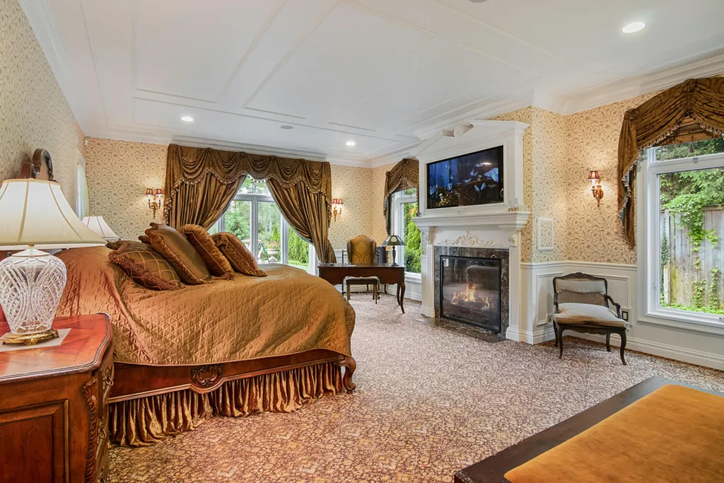 1 Lockhern Drive Home in Livingston Township, New Jersey. Step into the world of opulence with this custom-built, all-brick French Manor nestled on a tranquil cul-de-sac. The mature landscaping, saltwater pool, hot tub, limestone pool deck, and outdoor fireplace spanning 30 feet create a private oasis. Inside, discover a grand entrance hall leading to a stunning living room with a soaring 2-story ceiling, fireplace, and French doors opening to the patio and pool.