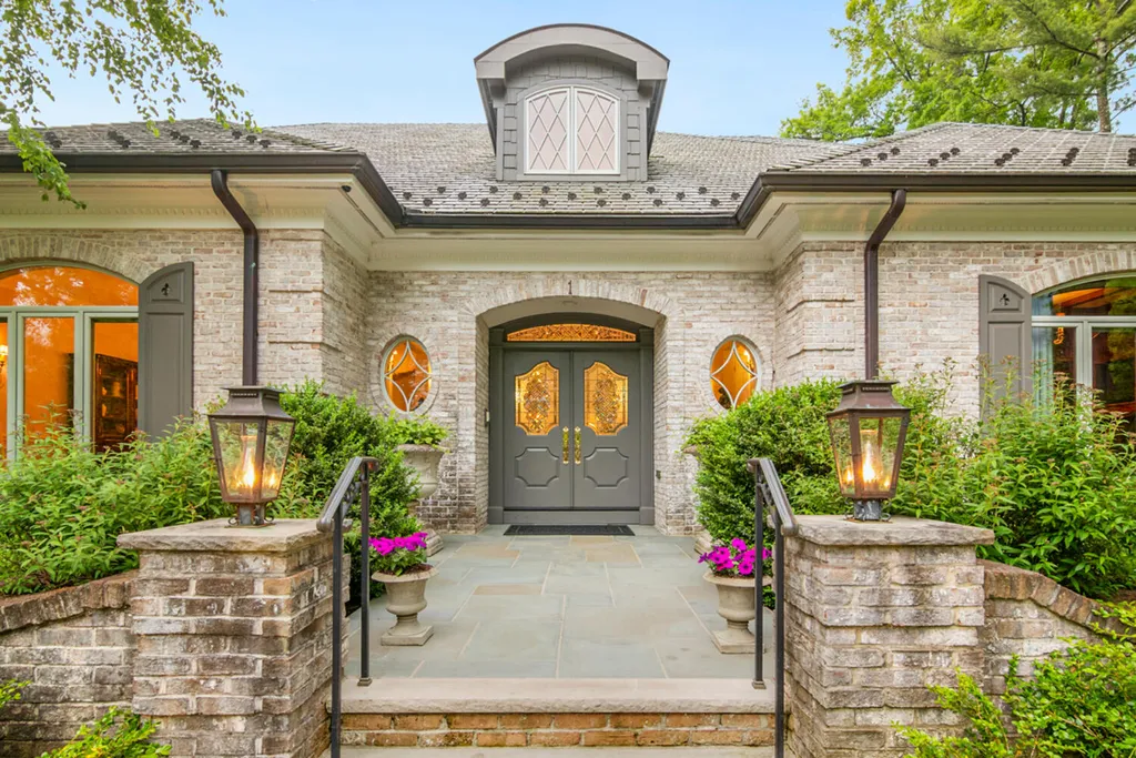 1 Lockhern Drive Home in Livingston Township, New Jersey. Step into the world of opulence with this custom-built, all-brick French Manor nestled on a tranquil cul-de-sac. The mature landscaping, saltwater pool, hot tub, limestone pool deck, and outdoor fireplace spanning 30 feet create a private oasis. Inside, discover a grand entrance hall leading to a stunning living room with a soaring 2-story ceiling, fireplace, and French doors opening to the patio and pool.