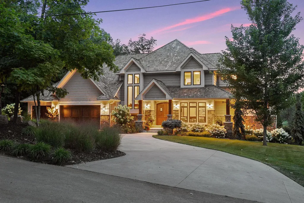 10 Myrtlewood Road Home in Wayzata, Minnesota. This magnificent custom-built home is a true masterpiece, perfectly blending sophistication and luxury with everyday comfort and warmth. From the moment you step inside, you'll be captivated by the quality and unique features that define this exceptional residence.