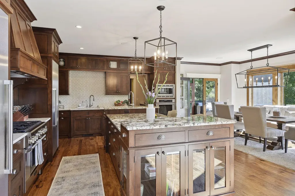 10 Myrtlewood Road Home in Wayzata, Minnesota. This magnificent custom-built home is a true masterpiece, perfectly blending sophistication and luxury with everyday comfort and warmth. From the moment you step inside, you'll be captivated by the quality and unique features that define this exceptional residence.