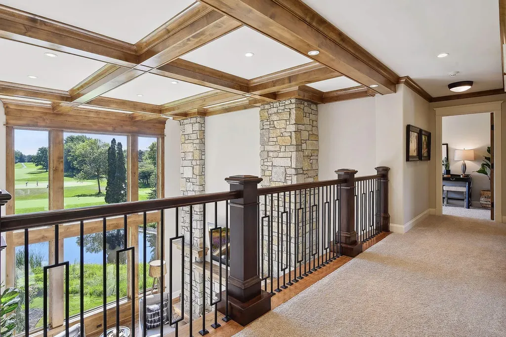 10 Myrtlewood Road Home in Wayzata, Minnesota. This magnificent custom-built home is a true masterpiece, perfectly blending sophistication and luxury with everyday comfort and warmth. From the moment you step inside, you'll be captivated by the quality and unique features that define this exceptional residence.