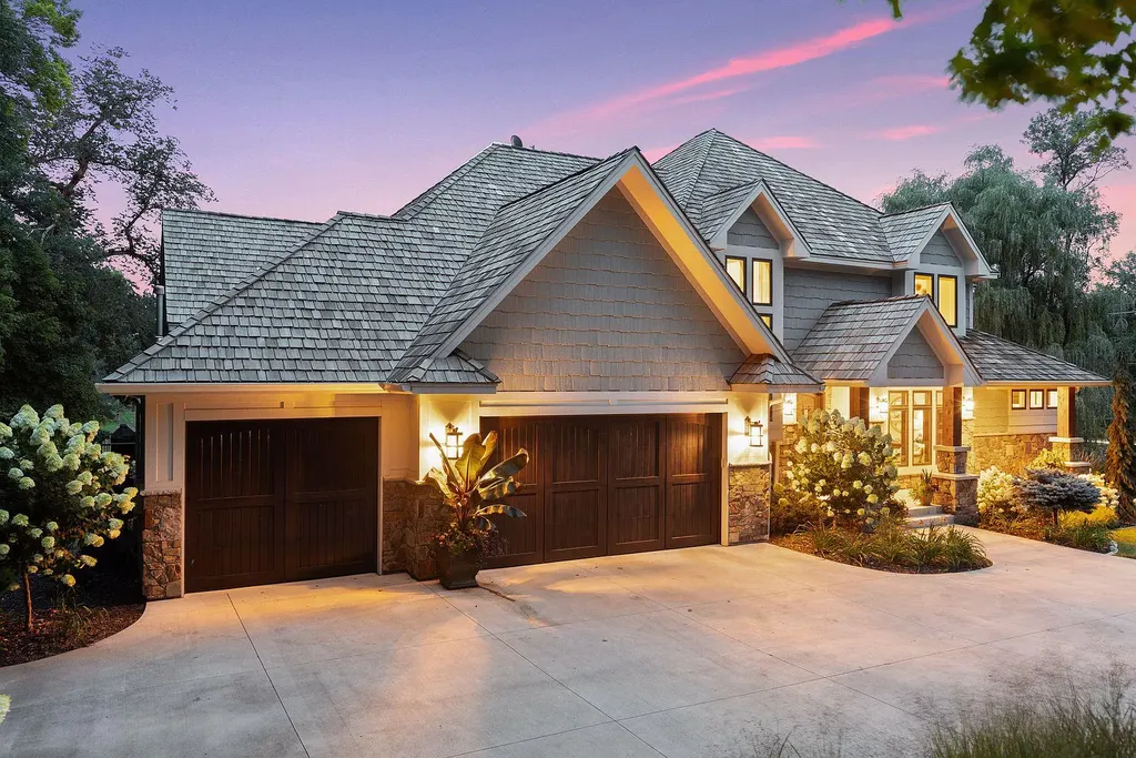 10 Myrtlewood Road Home in Wayzata, Minnesota. This magnificent custom-built home is a true masterpiece, perfectly blending sophistication and luxury with everyday comfort and warmth. From the moment you step inside, you'll be captivated by the quality and unique features that define this exceptional residence.