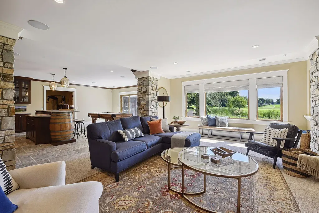 10 Myrtlewood Road Home in Wayzata, Minnesota. This magnificent custom-built home is a true masterpiece, perfectly blending sophistication and luxury with everyday comfort and warmth. From the moment you step inside, you'll be captivated by the quality and unique features that define this exceptional residence.