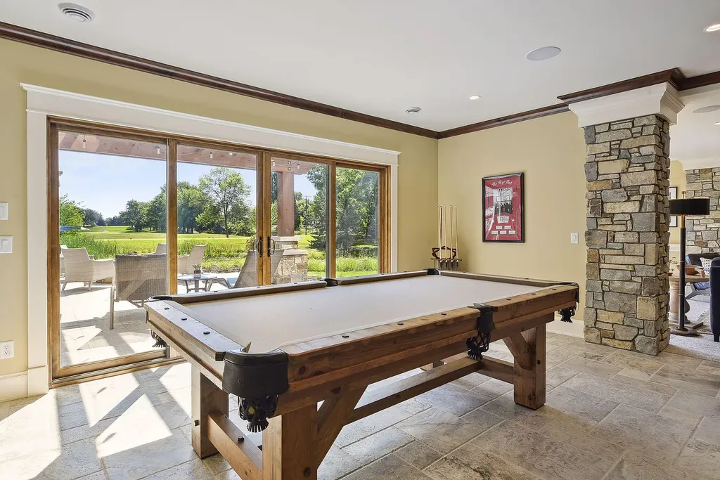 10 Myrtlewood Road Home in Wayzata, Minnesota. This magnificent custom-built home is a true masterpiece, perfectly blending sophistication and luxury with everyday comfort and warmth. From the moment you step inside, you'll be captivated by the quality and unique features that define this exceptional residence.