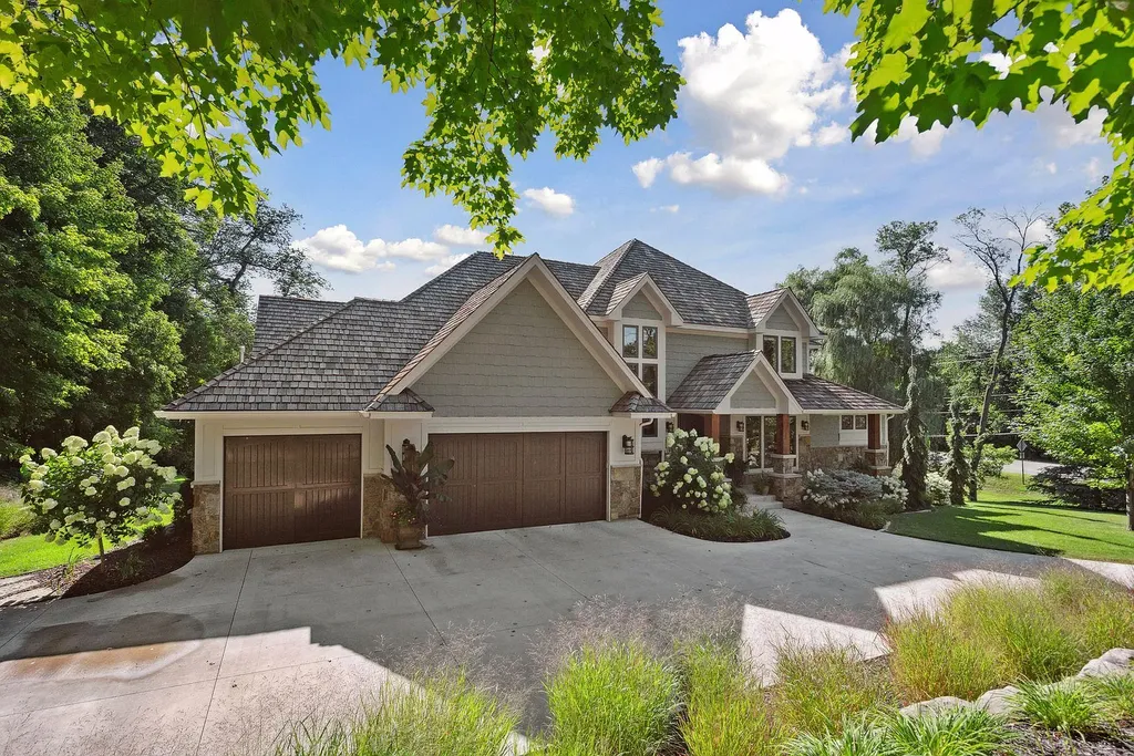 10 Myrtlewood Road Home in Wayzata, Minnesota. This magnificent custom-built home is a true masterpiece, perfectly blending sophistication and luxury with everyday comfort and warmth. From the moment you step inside, you'll be captivated by the quality and unique features that define this exceptional residence.