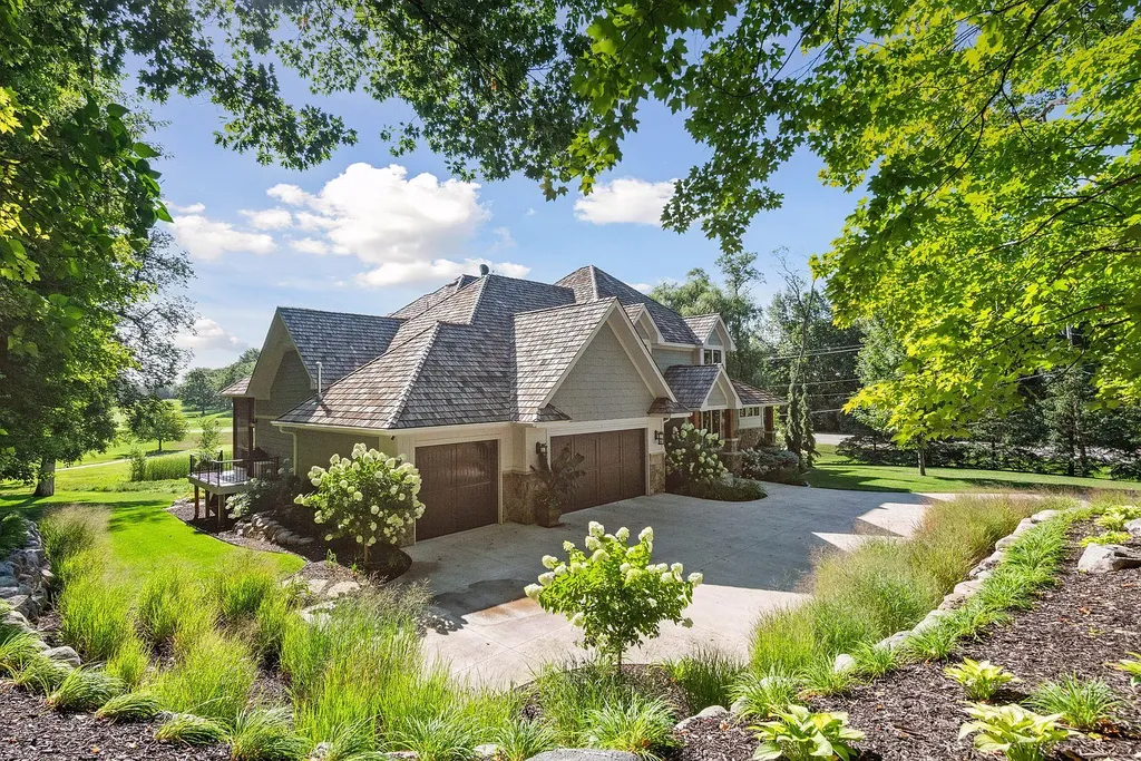 10 Myrtlewood Road Home in Wayzata, Minnesota. This magnificent custom-built home is a true masterpiece, perfectly blending sophistication and luxury with everyday comfort and warmth. From the moment you step inside, you'll be captivated by the quality and unique features that define this exceptional residence.