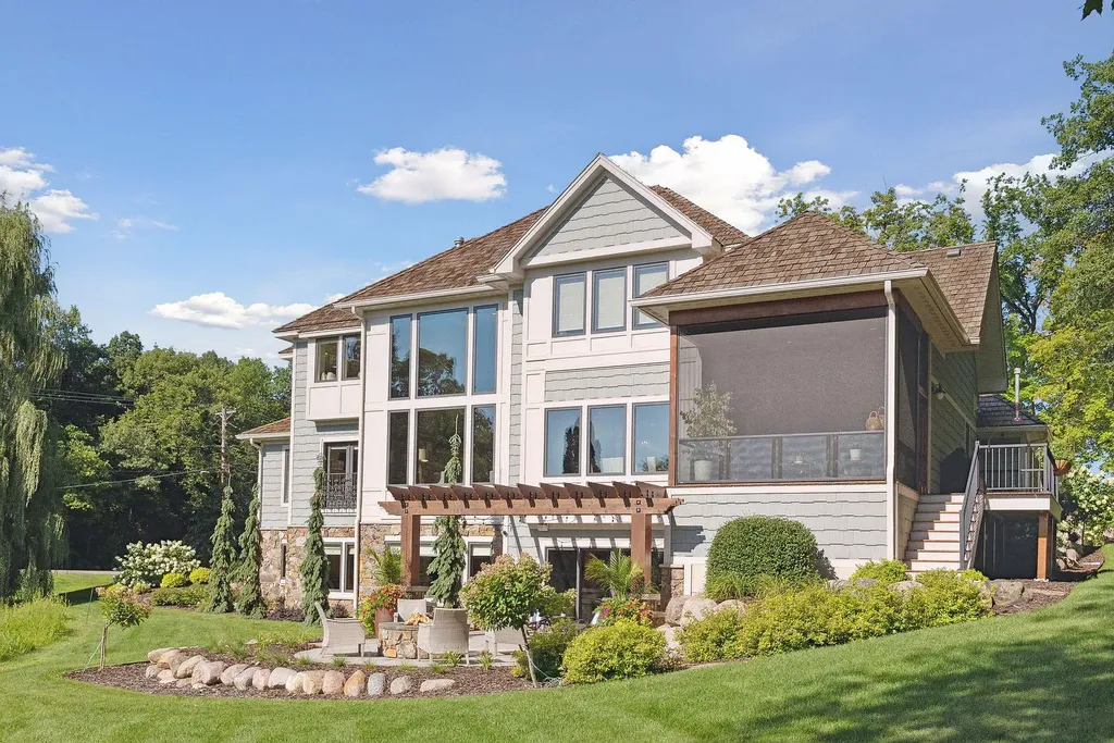 10 Myrtlewood Road Home in Wayzata, Minnesota. This magnificent custom-built home is a true masterpiece, perfectly blending sophistication and luxury with everyday comfort and warmth. From the moment you step inside, you'll be captivated by the quality and unique features that define this exceptional residence.