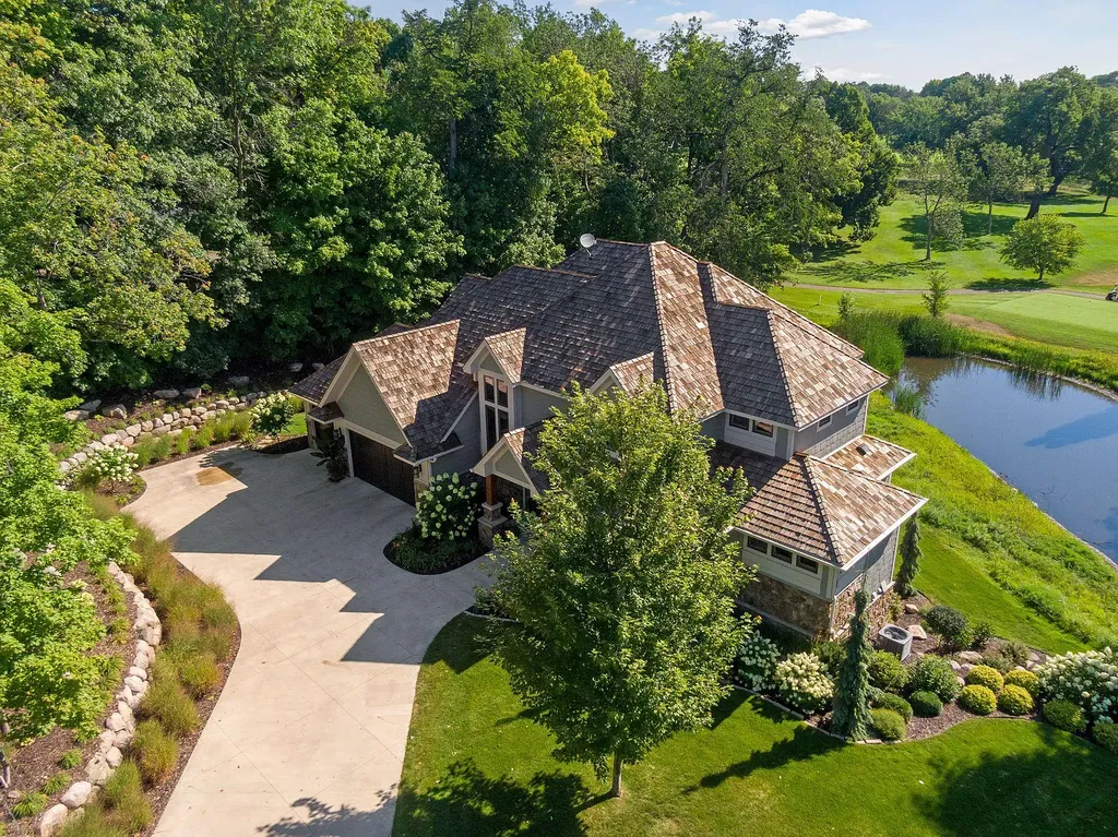 10 Myrtlewood Road Home in Wayzata, Minnesota. This magnificent custom-built home is a true masterpiece, perfectly blending sophistication and luxury with everyday comfort and warmth. From the moment you step inside, you'll be captivated by the quality and unique features that define this exceptional residence.