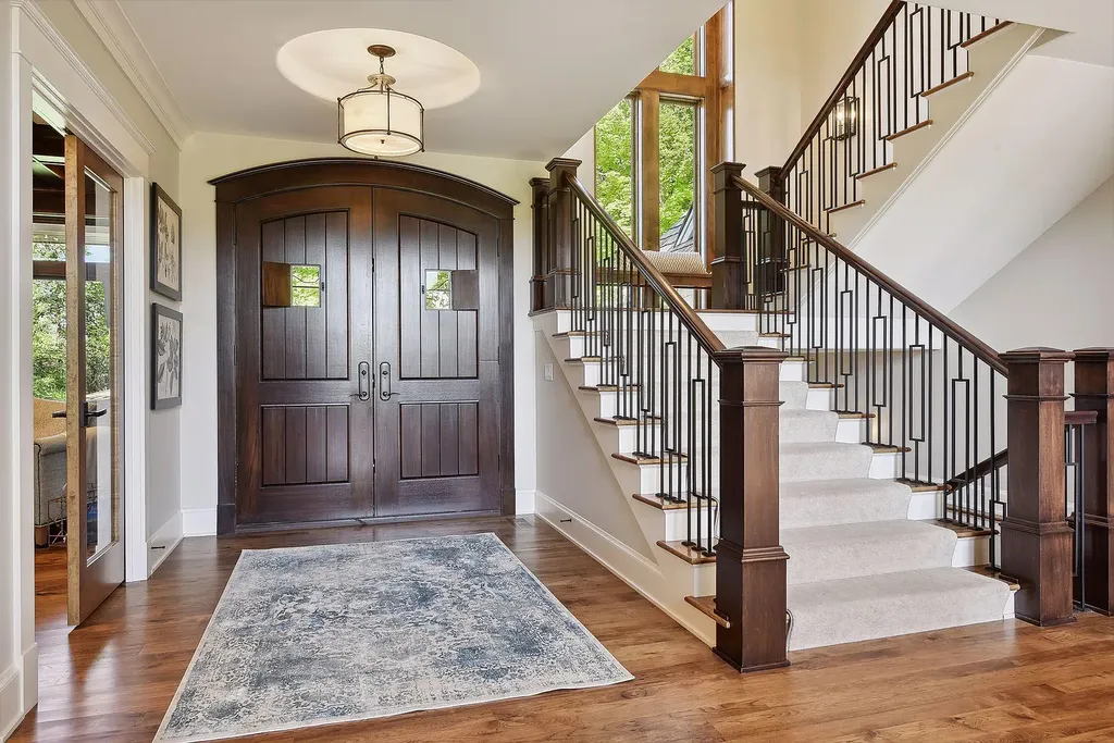 10 Myrtlewood Road Home in Wayzata, Minnesota. This magnificent custom-built home is a true masterpiece, perfectly blending sophistication and luxury with everyday comfort and warmth. From the moment you step inside, you'll be captivated by the quality and unique features that define this exceptional residence.