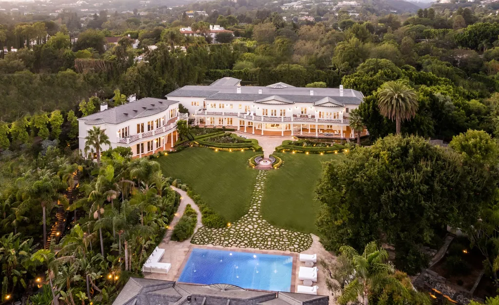 10250 West Sunset Boulevard Home in Los Angeles, California. Discover the epitome of luxury living at this meticulously reimagined Paul Williams designed estate in Holmby Hills, spanning approximately 2.8 acres. Comprising three structures with nearly 30,000 SF of living space, this world-class property offers unrivaled privacy, an expansive motor court, 14 bedrooms, 25 baths, and an array of amenities including a theater, game room, and a wellness-focused pool house. 