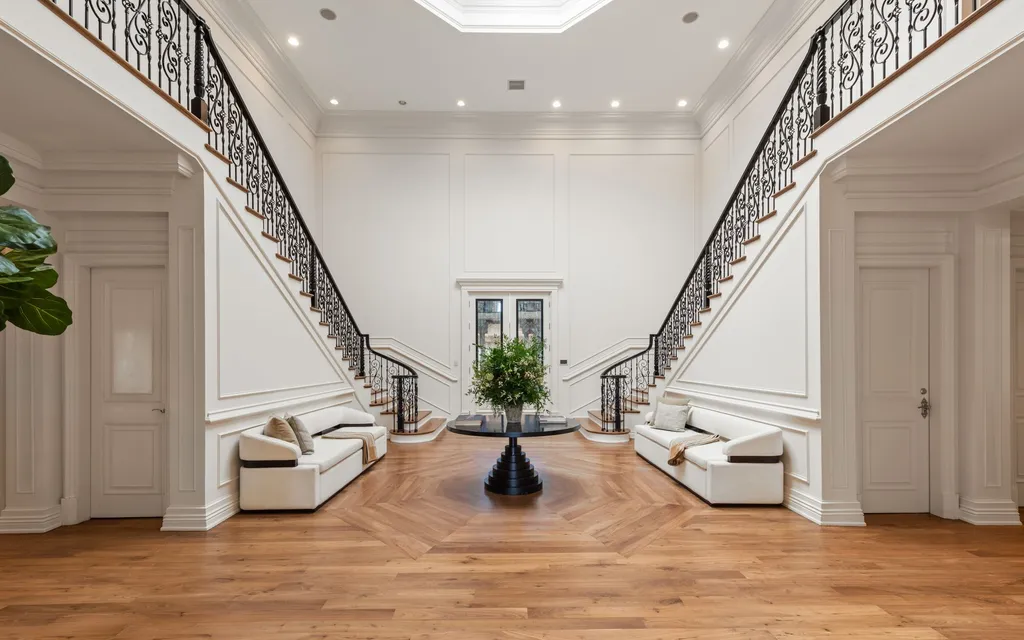 10250 West Sunset Boulevard Home in Los Angeles, California. Discover the epitome of luxury living at this meticulously reimagined Paul Williams designed estate in Holmby Hills, spanning approximately 2.8 acres. Comprising three structures with nearly 30,000 SF of living space, this world-class property offers unrivaled privacy, an expansive motor court, 14 bedrooms, 25 baths, and an array of amenities including a theater, game room, and a wellness-focused pool house. 