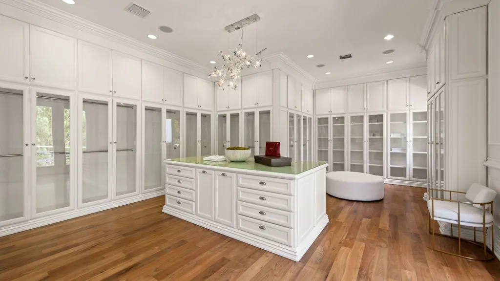 10250 West Sunset Boulevard Home in Los Angeles, California. Discover the epitome of luxury living at this meticulously reimagined Paul Williams designed estate in Holmby Hills, spanning approximately 2.8 acres. Comprising three structures with nearly 30,000 SF of living space, this world-class property offers unrivaled privacy, an expansive motor court, 14 bedrooms, 25 baths, and an array of amenities including a theater, game room, and a wellness-focused pool house. 