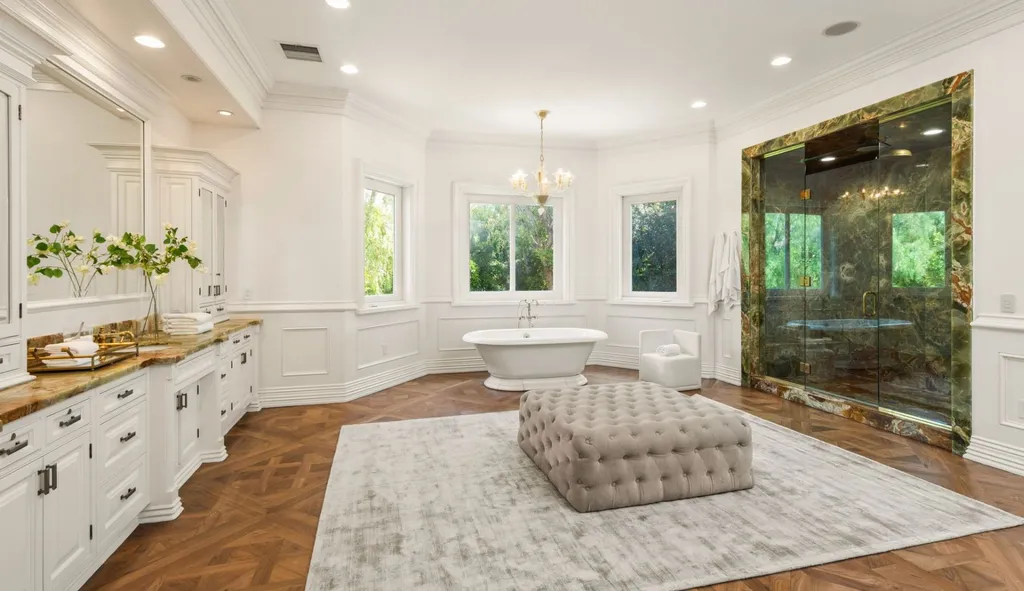 10250 West Sunset Boulevard Home in Los Angeles, California. Discover the epitome of luxury living at this meticulously reimagined Paul Williams designed estate in Holmby Hills, spanning approximately 2.8 acres. Comprising three structures with nearly 30,000 SF of living space, this world-class property offers unrivaled privacy, an expansive motor court, 14 bedrooms, 25 baths, and an array of amenities including a theater, game room, and a wellness-focused pool house. 