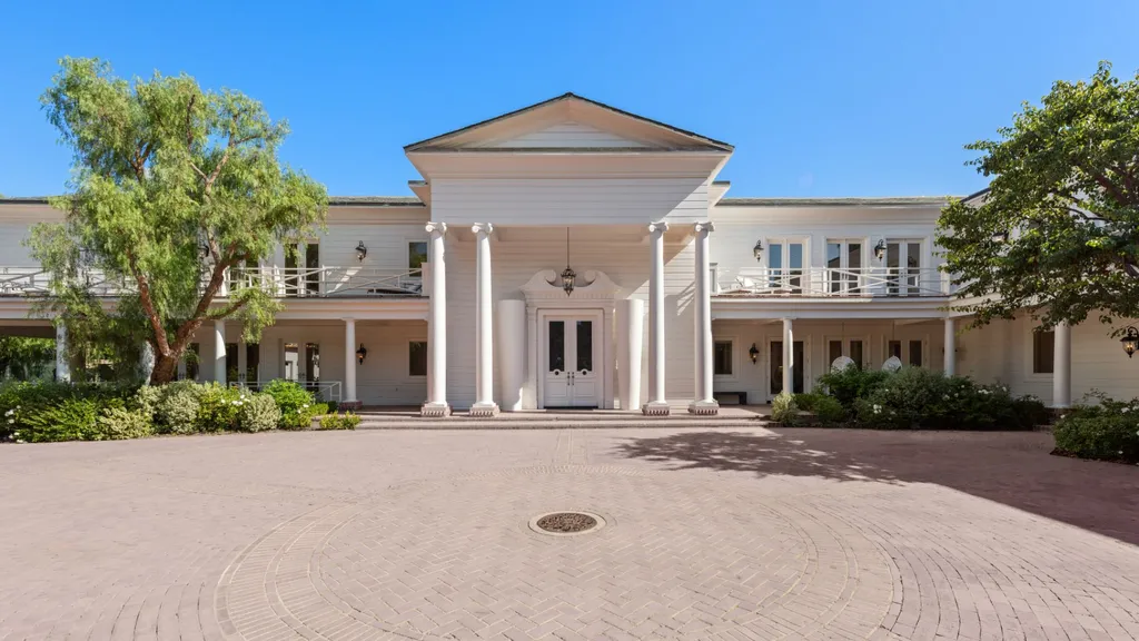 10250 West Sunset Boulevard Home in Los Angeles, California. Discover the epitome of luxury living at this meticulously reimagined Paul Williams designed estate in Holmby Hills, spanning approximately 2.8 acres. Comprising three structures with nearly 30,000 SF of living space, this world-class property offers unrivaled privacy, an expansive motor court, 14 bedrooms, 25 baths, and an array of amenities including a theater, game room, and a wellness-focused pool house. 